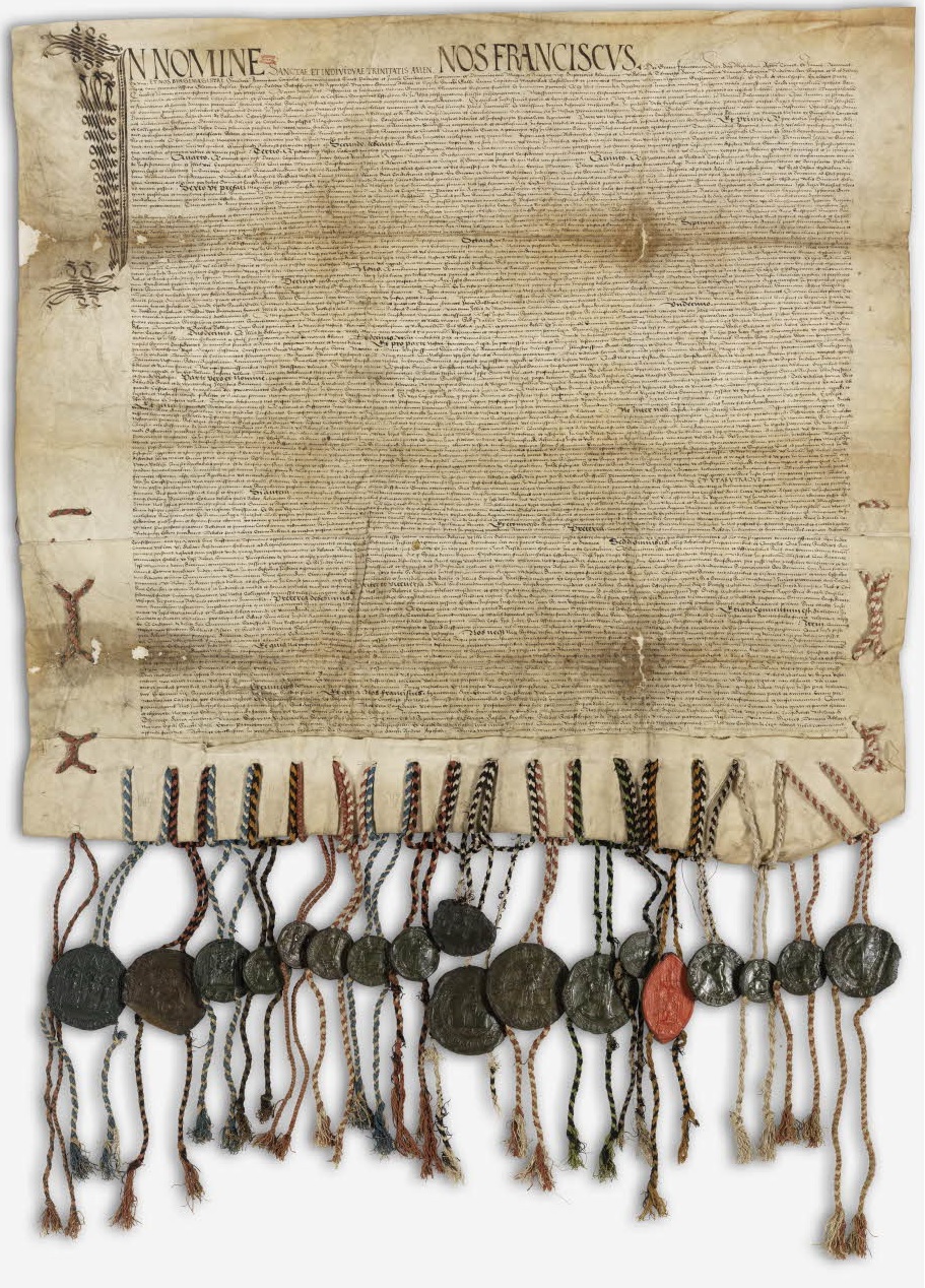 Le traité de Fribourg rédigé sur un parchemin, avec de nombreux sceaux officiels de cire attaché par des cordons en bas.