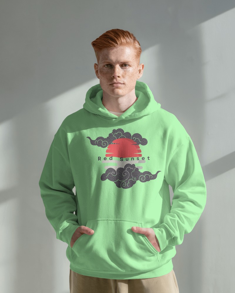  Sunlit Interior Hoodie Mockup Male Model With Red Hair Wearing Light Green Hoodie With Red Sunset Design Soft Shadows And Natural Light