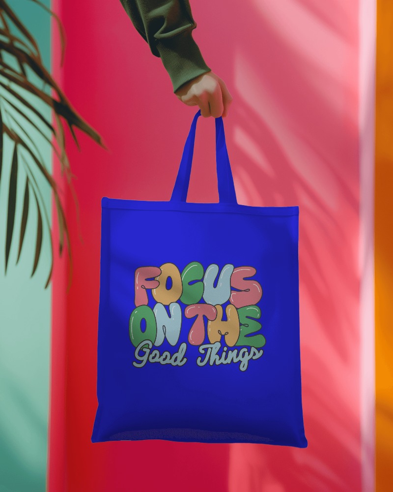 Tote Bag Mockup Hanging On Hand Of A Person Wearing Green Sweatshirt