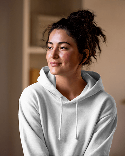 Cropped Streetwear Hoodie Mockup Female Model Posing With Hand On Hip City Backdrop Trendy And Chic Vibe