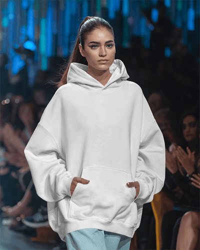 Runway Fashion Hoodie Mockup Female Model Confident Expression Soft Blue Color Playful Graphic Design