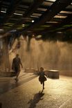 The artwork is also equipped with mist dispensers - much to the joy of local children. On a sweltering August afternoon, this girl was playing in the mist without a care, ignoring the 40 degrees on the thermometer.