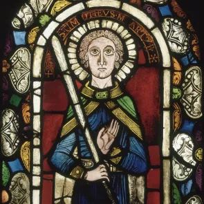 Multicolored stained glass window depicting Saint Timothy in full length. Photograph on a neutral background.