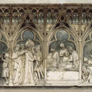 Carved and polychrome stone plaque depicting scenes from the life of Christ. Front view.
