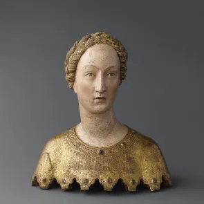 Polychrome wood sculpture: bust of a woman with a braid wrapped around her head. Front view.