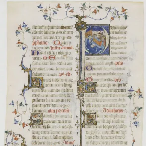 Illuminated manuscript leaf adorned with text and illuminated initials. Front view.
