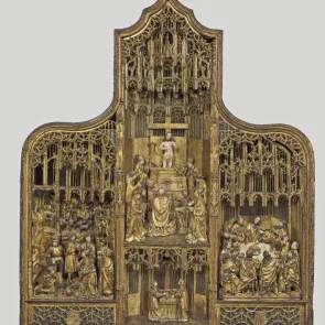 Carved and painted wooden altarpiece depicting biblical scenes. Front view.