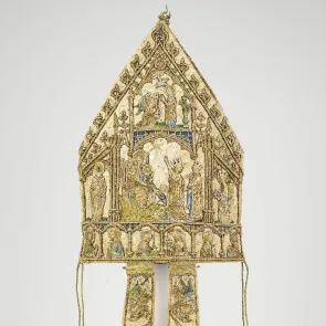 Embroidered mitre: rear panel adorned with historical scenes and lappets featuring a bishop and a Virgin with Child. Rear view.