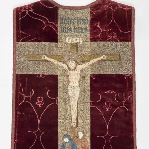 Back of a red velvet chasuble: orphrey featuring Christ on the cross, the Virgin, and Saint John. Front view.