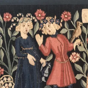 Detail of a tapestry depicting a couple wearing flower garlands. Front view.
