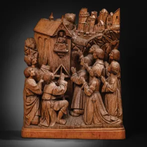 Wooden sculpture depicting a house with an image of the Virgin and Child and nine praying figures. Front view.