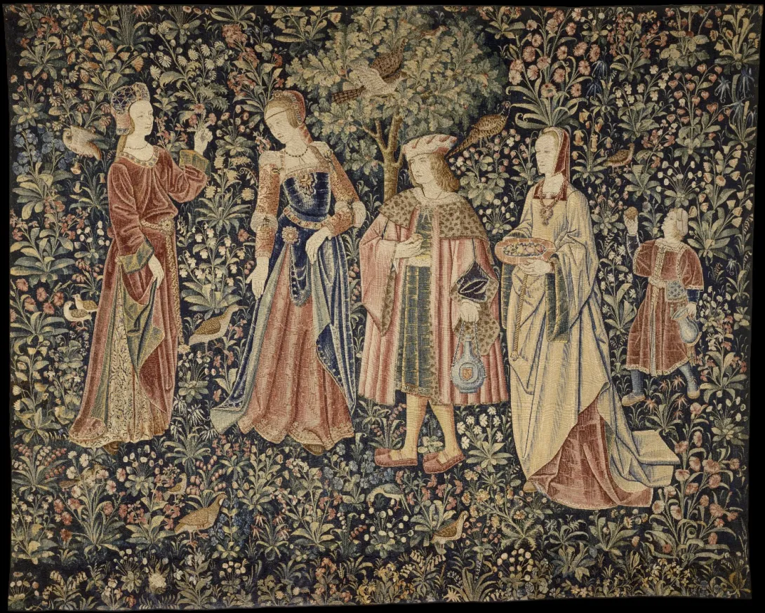 Tapestry depicting three women and one man, along with a smaller male figure in the background on a floral backdrop.