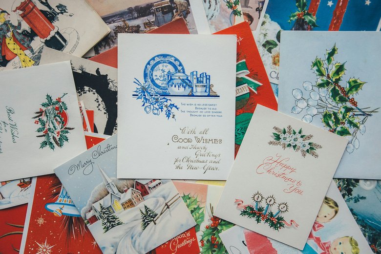 Dozens of greeting cards spread out overlapping each other, showing a range of different designs and styles.