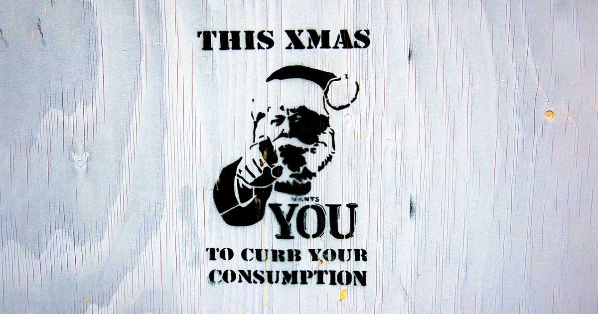 grafit s sliko Božička in napisom This Xmas wants you to curb your consumption
