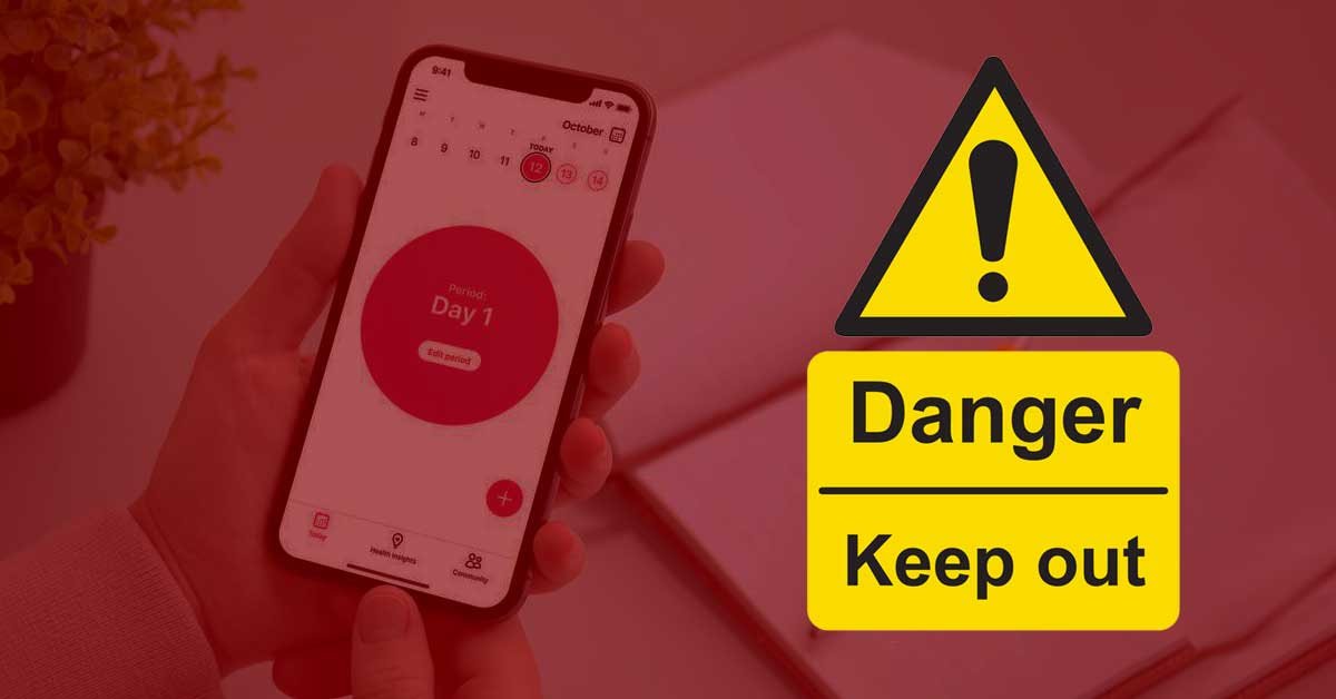 V ozadju je roka z mobilnim telefonom, na katerem je odprta aplikacija za vodenje menstrualnega koledarja, v ospredju pa je znam za nevarnost, pod katerim piše Danger / Keep out.