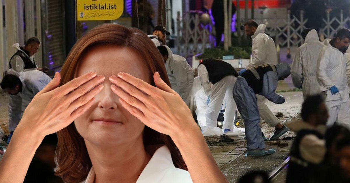 v ozadju posledice eksplozije, spredaj pa Tanja Fajon, ki si drži dlani čez oči