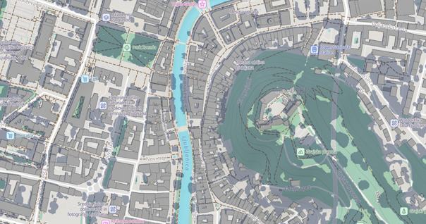 Zemljevid središča Ljubljane v aplikaciji Shadowmap z reko Ljubljanico v sredini, Grajskim gričem na desni, Parkom Zvezda na levi ter sencami stavb in terena