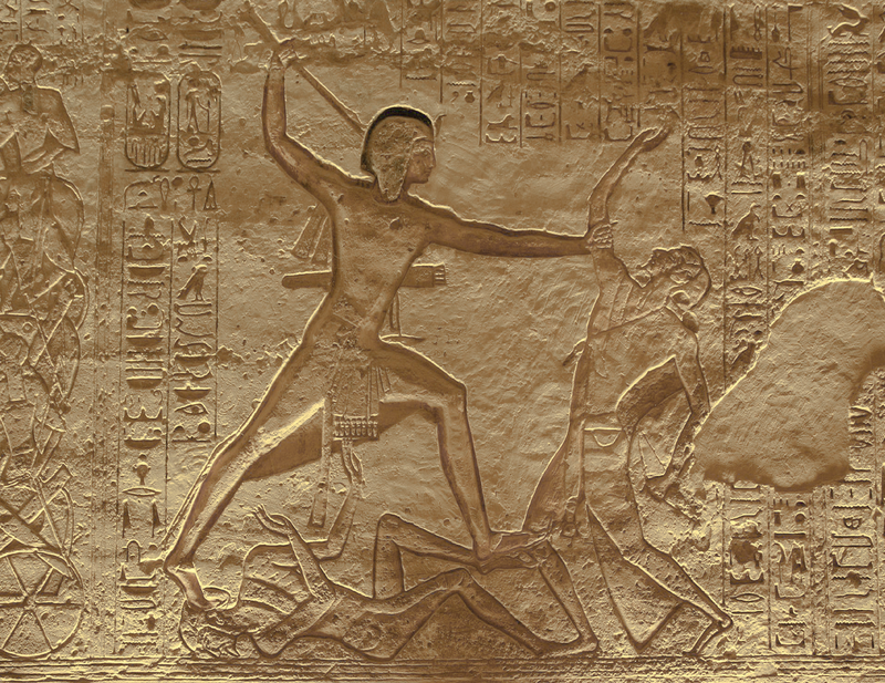 Relief in temple of Ramesses II, Abu Simbel: Ramses II slays an enemy while he tramples on another in the battle of Kadesh in 1274 BC.