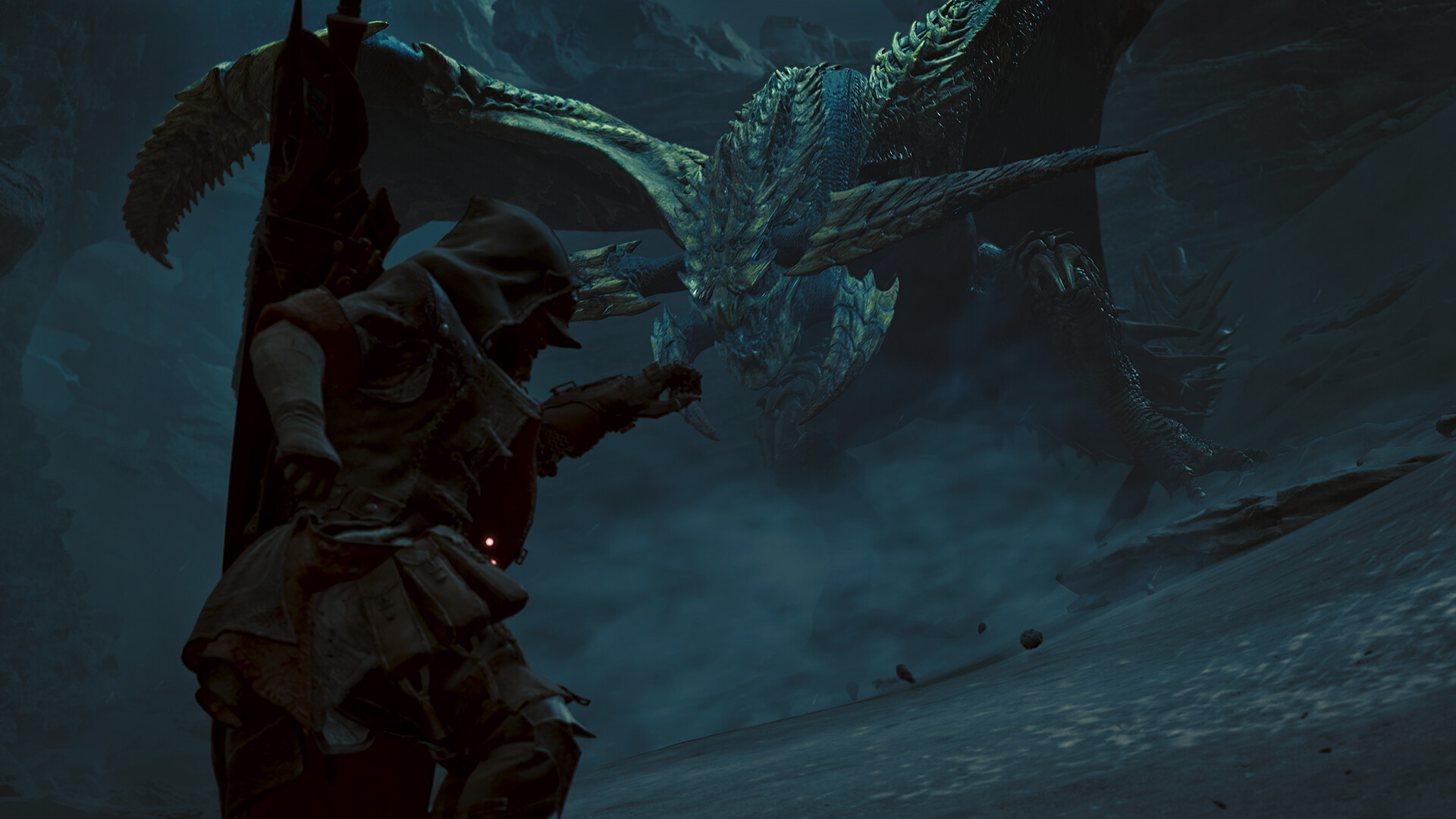 Un chasseur de Monster Hunter Wilds fait face à un grand monstre ailé dans une zone rocheuse plongée dans la pénombre