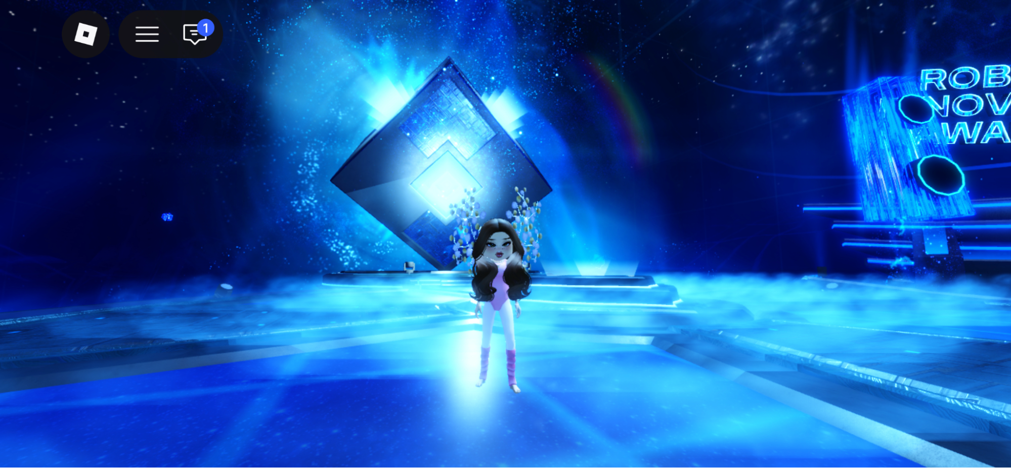 La station de vote des Roblox Innovation Awards 2026 avec son cube lumineux en rotation au centre du hub The Block