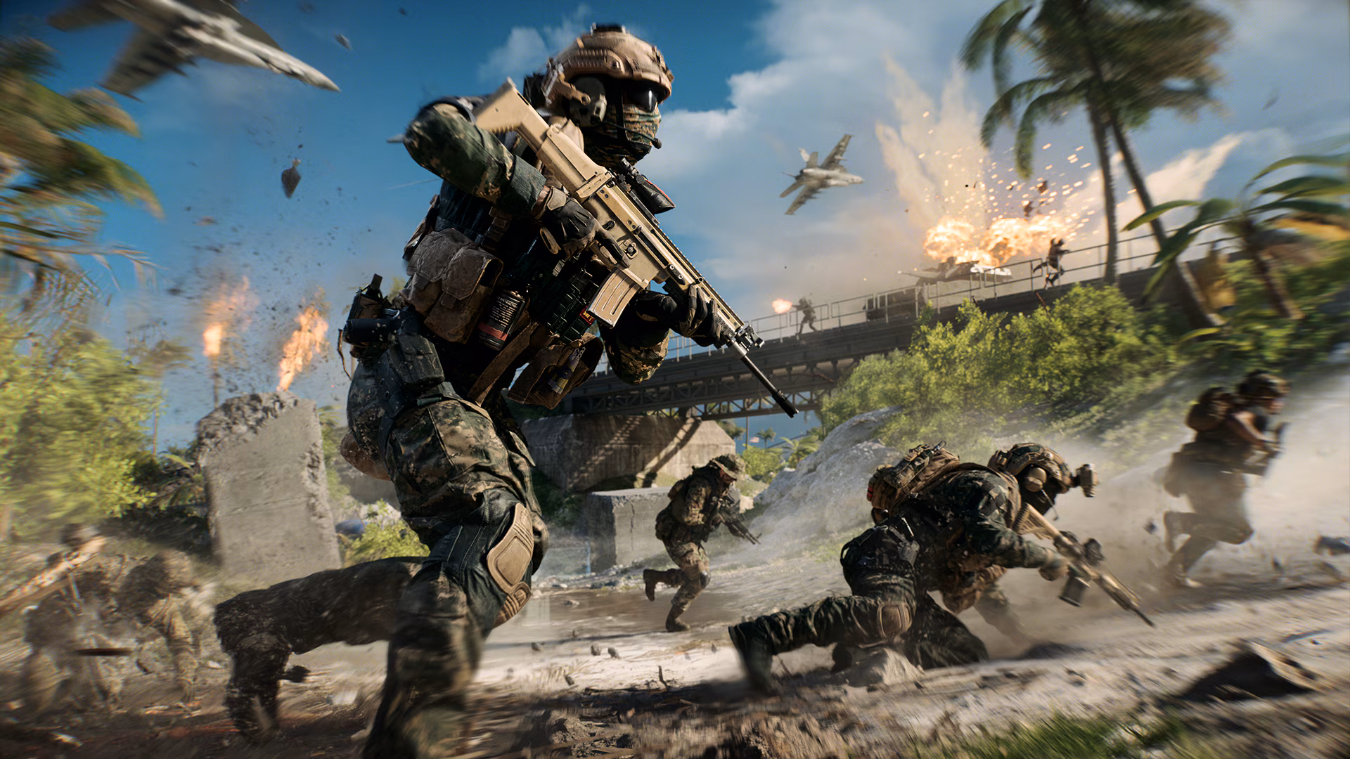 Assaut d'infanterie sur une plage de l'Île Wake dans Battlefield 6, devant un pont routier, un avion passant au-dessus dans les explosions