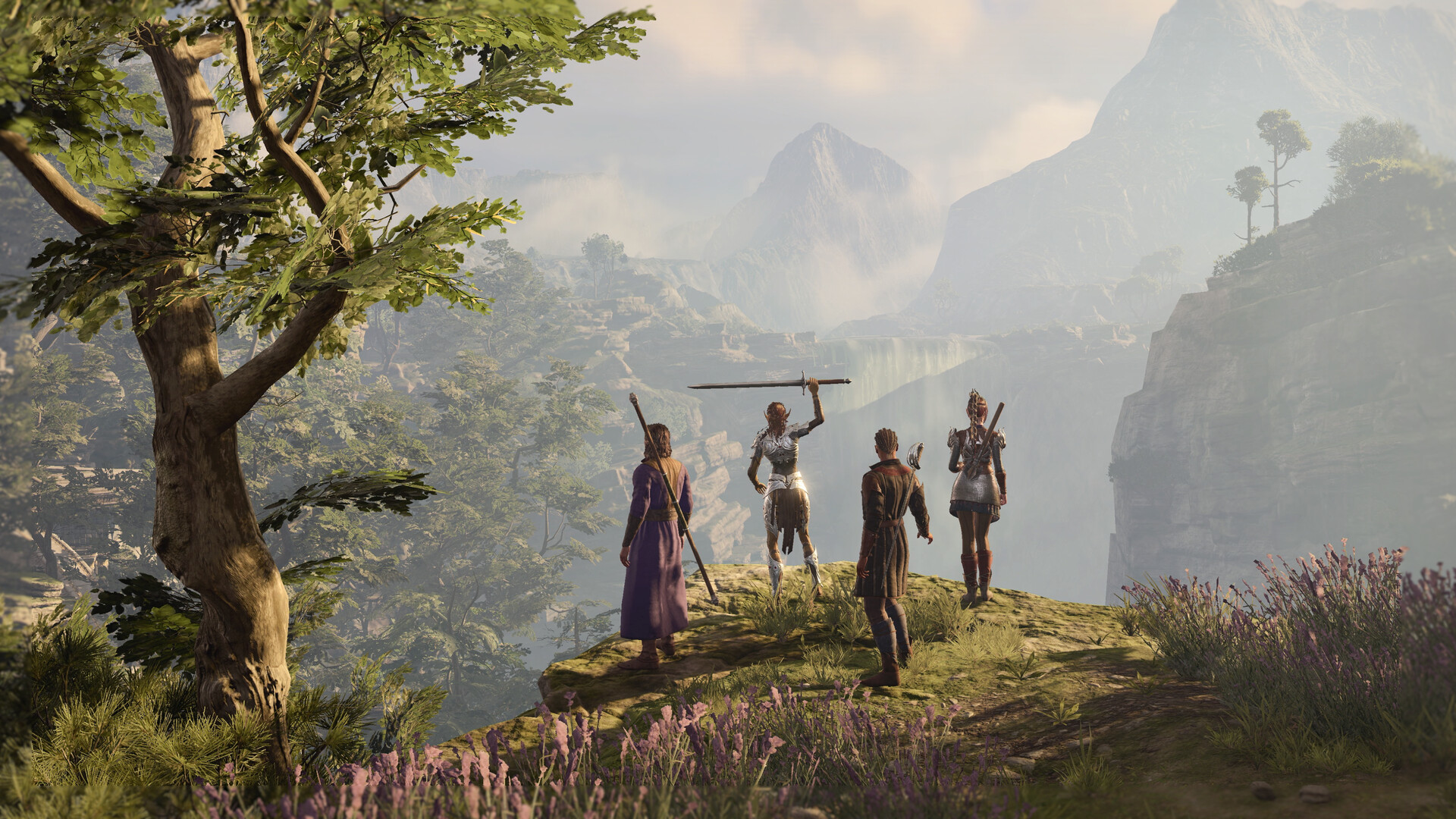 Un groupe d'aventuriers de Baldur's Gate 3 domine une vallée de montagne au coucher du soleil