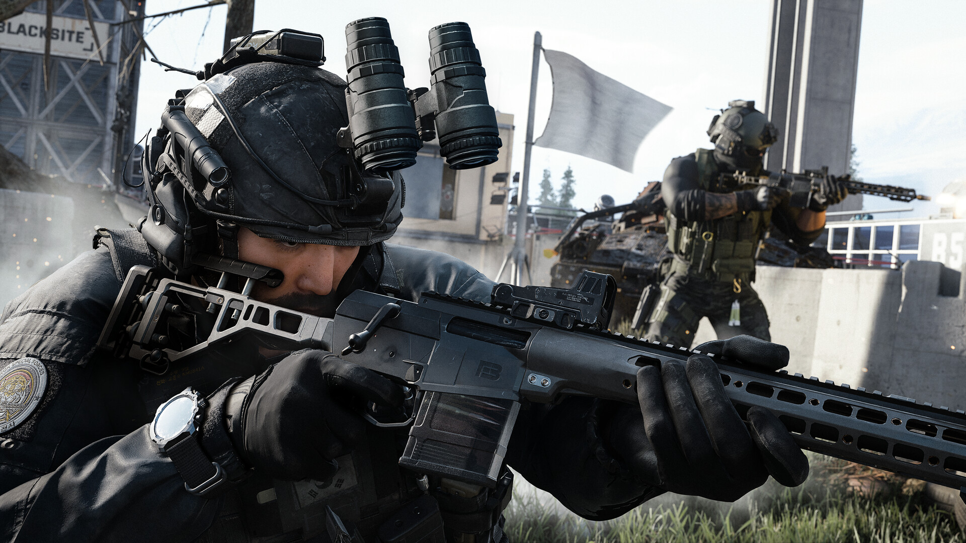 Un soldat vise à l'arme d'épaule tandis qu'un second progresse derrière un véhicule détruit, dans la bêta de Modern Warfare 4