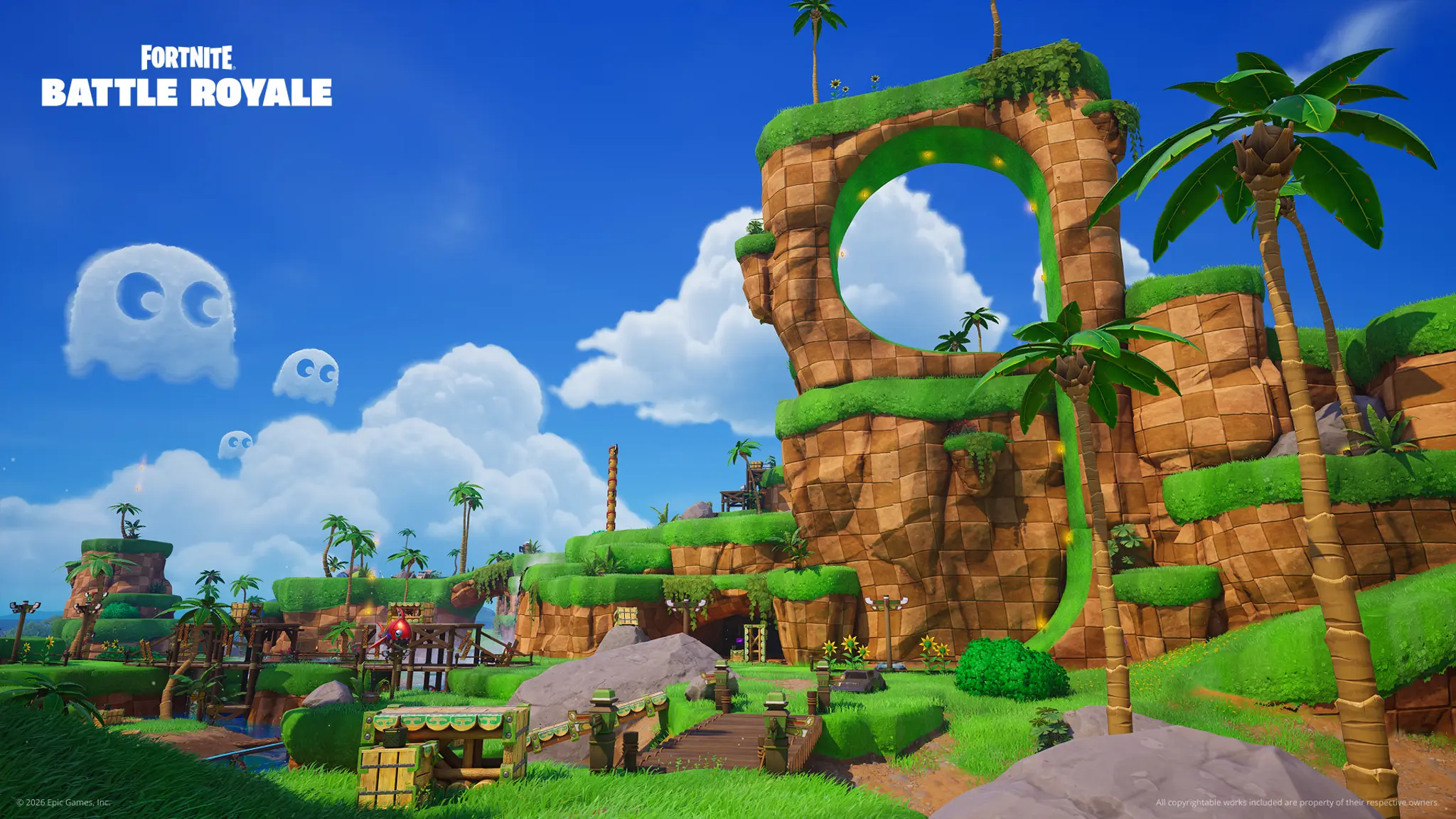Une boucle de piste verte et des falaises à damier au-dessus d'un décor tropical, dans le point d'intérêt Green Hill Zone de Fortnite