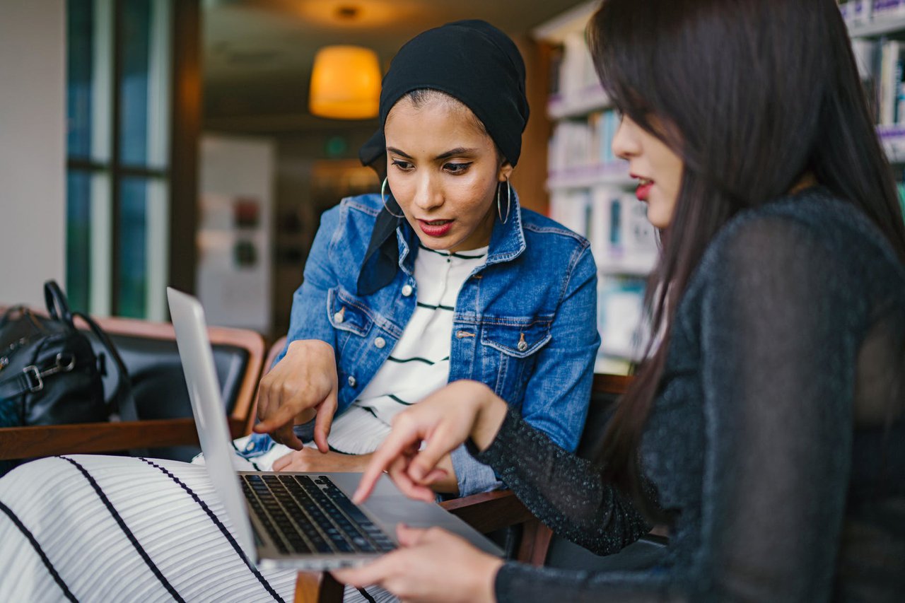 Blog - Top 10 Steps to Lift the Mood - Two women talking over a computer