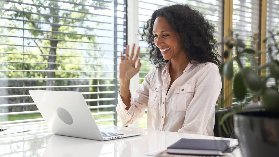 Blog - 3 tips to increase your performance working from home - An employee having a video call meeting from home