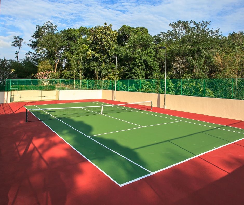 How does professional tennis court cleaning improve playability?