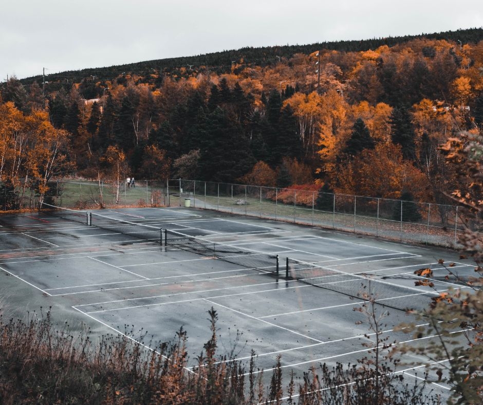 How do professional cleaners ensure tennis courts are safe to play on?