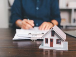 What happens during the closing process of a business sale?