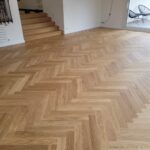Pose collée à Bâton Rompu de Parquet Chêne Listone Giordano