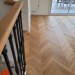 Pose collée à Bâton Rompu de Parquet Chêne Listone Giordano